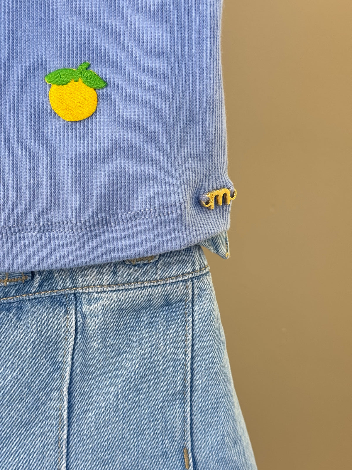 Conjunto Infantil Regata Lilás Estampa Limões e Shorts Saia Jeans Com Pregas - Momi